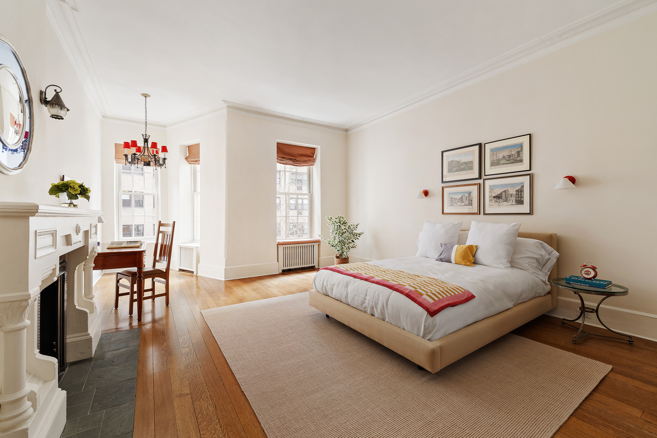 129 East 81st Street Manhattan, NY 10028 - Photo 4 of 17 a bedroom with a bed and a table in it