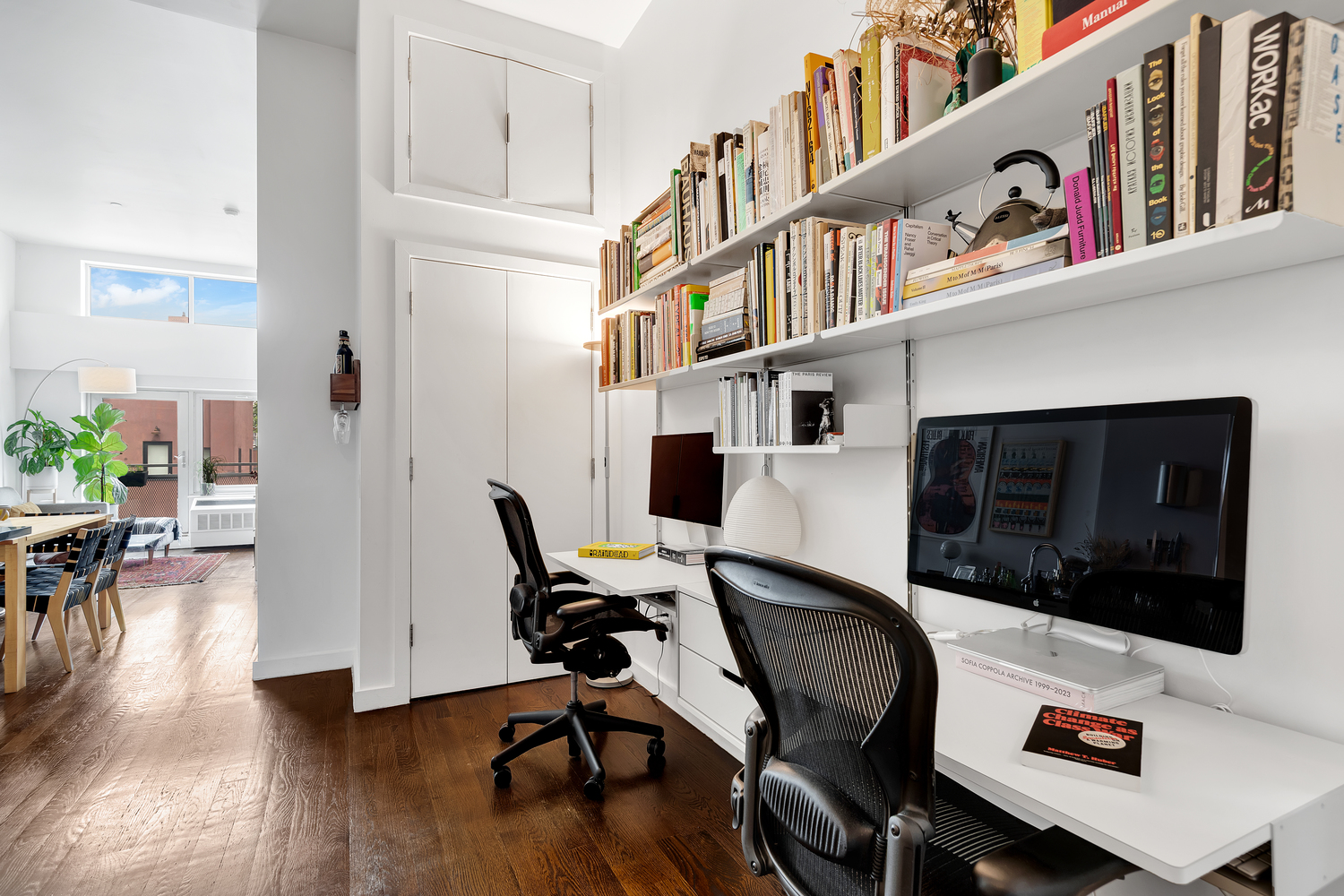 27 Quincy Street, Unit 4D Brooklyn, NY 11238 - Photo 5 of 8 a living room with furniture and a flat screen tv