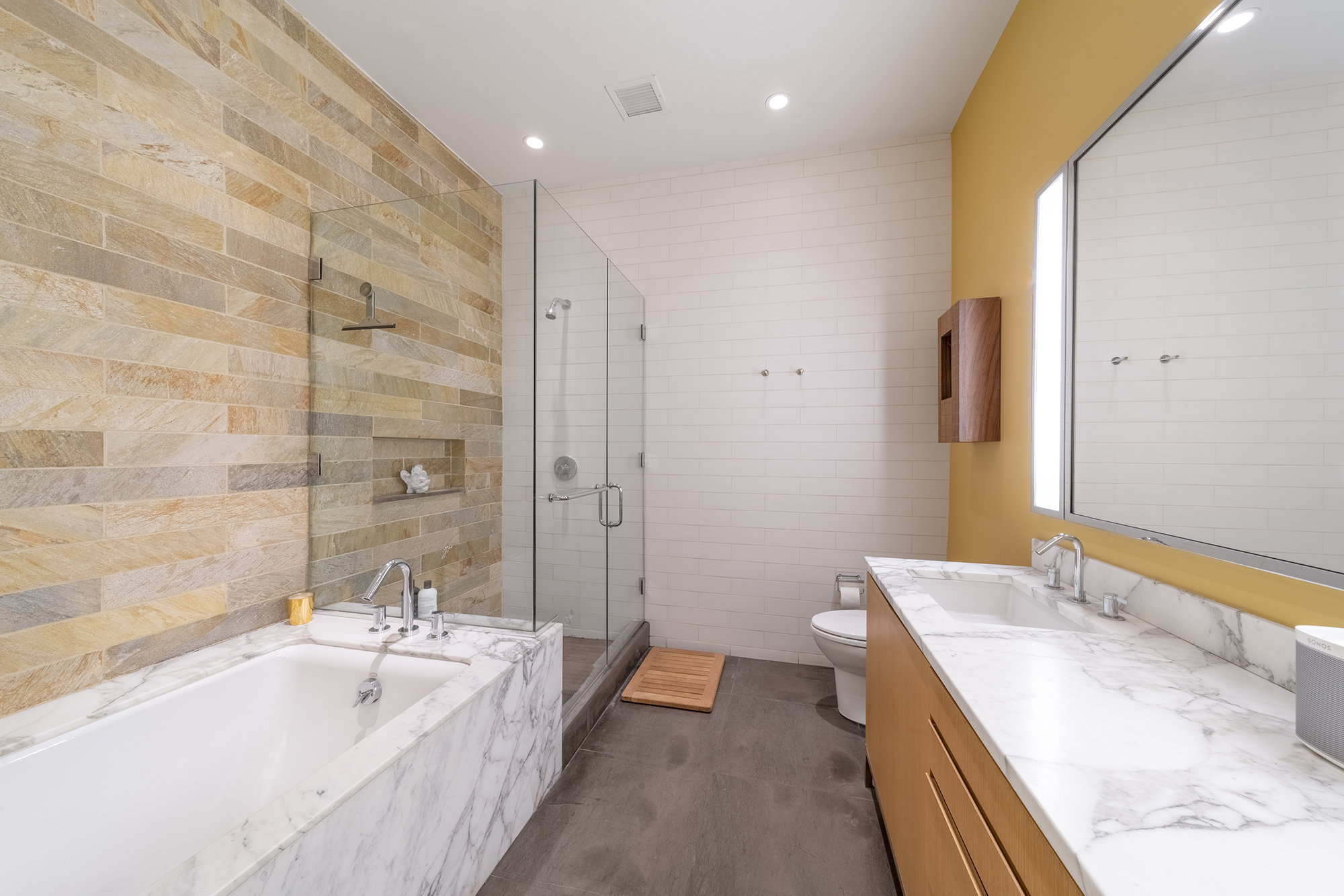 263 9th Avenue, Unit 3E Manhattan, NY 10001 - Photo 10 of 17 a spacious bathroom with a tub sink and mirror