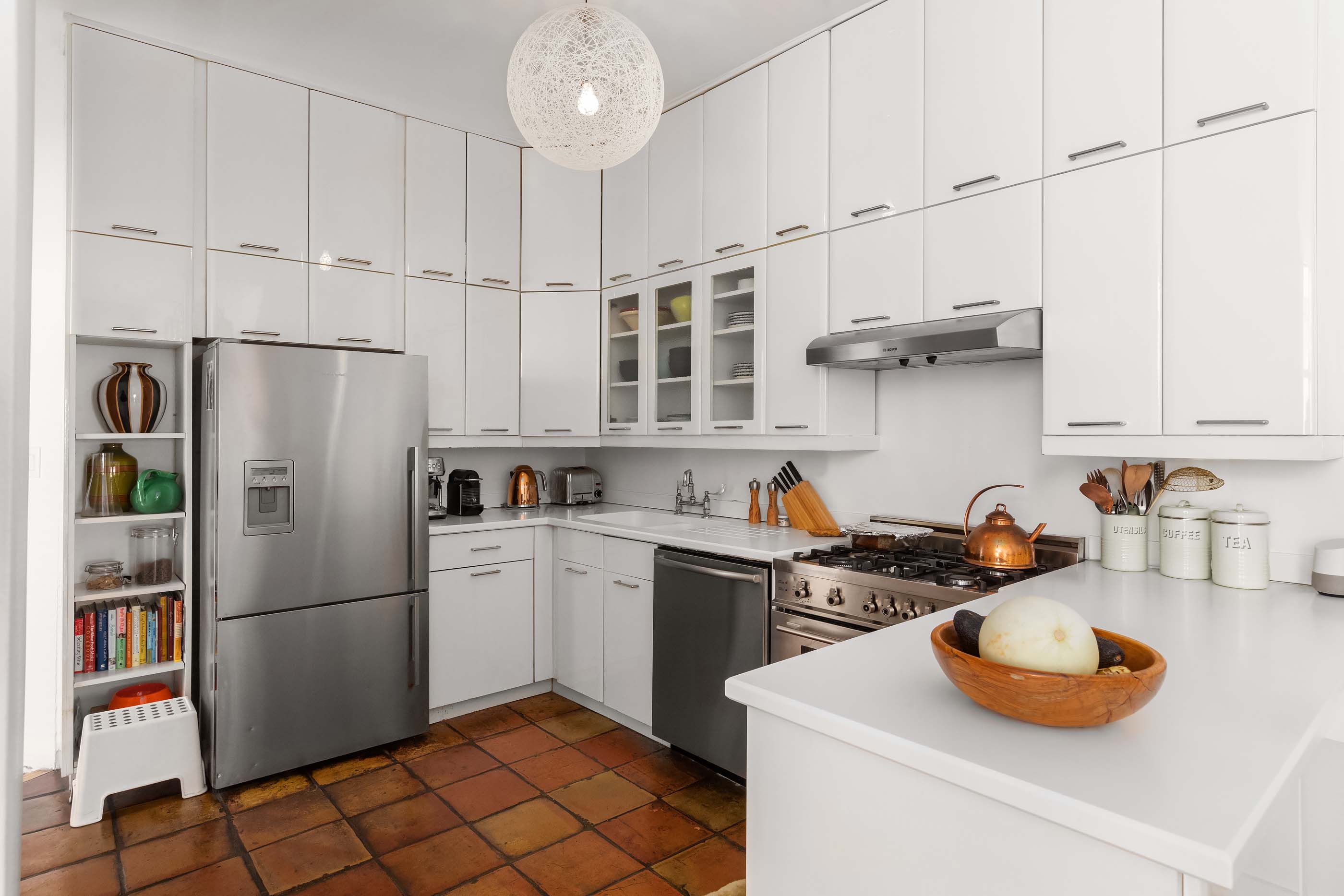 57 Laight Street, Unit 3 Manhattan, NY 10013 - Photo 6 of 15 a kitchen with stainless steel appliances granite countertop a sink stove and refrigerator
