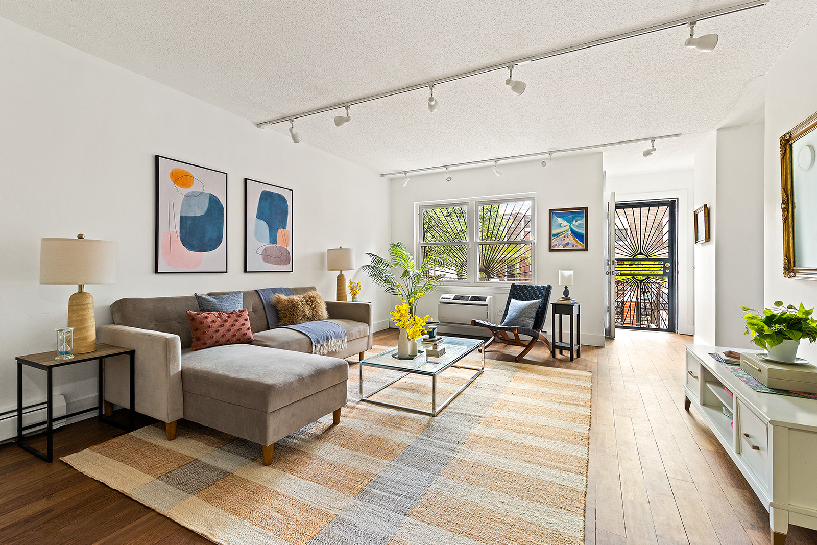 119 Suydam Street Brooklyn, NY 11221 - Photo 1 of 16 a living room with furniture and next to a window
