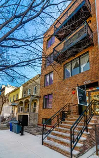 a view of a building with a street