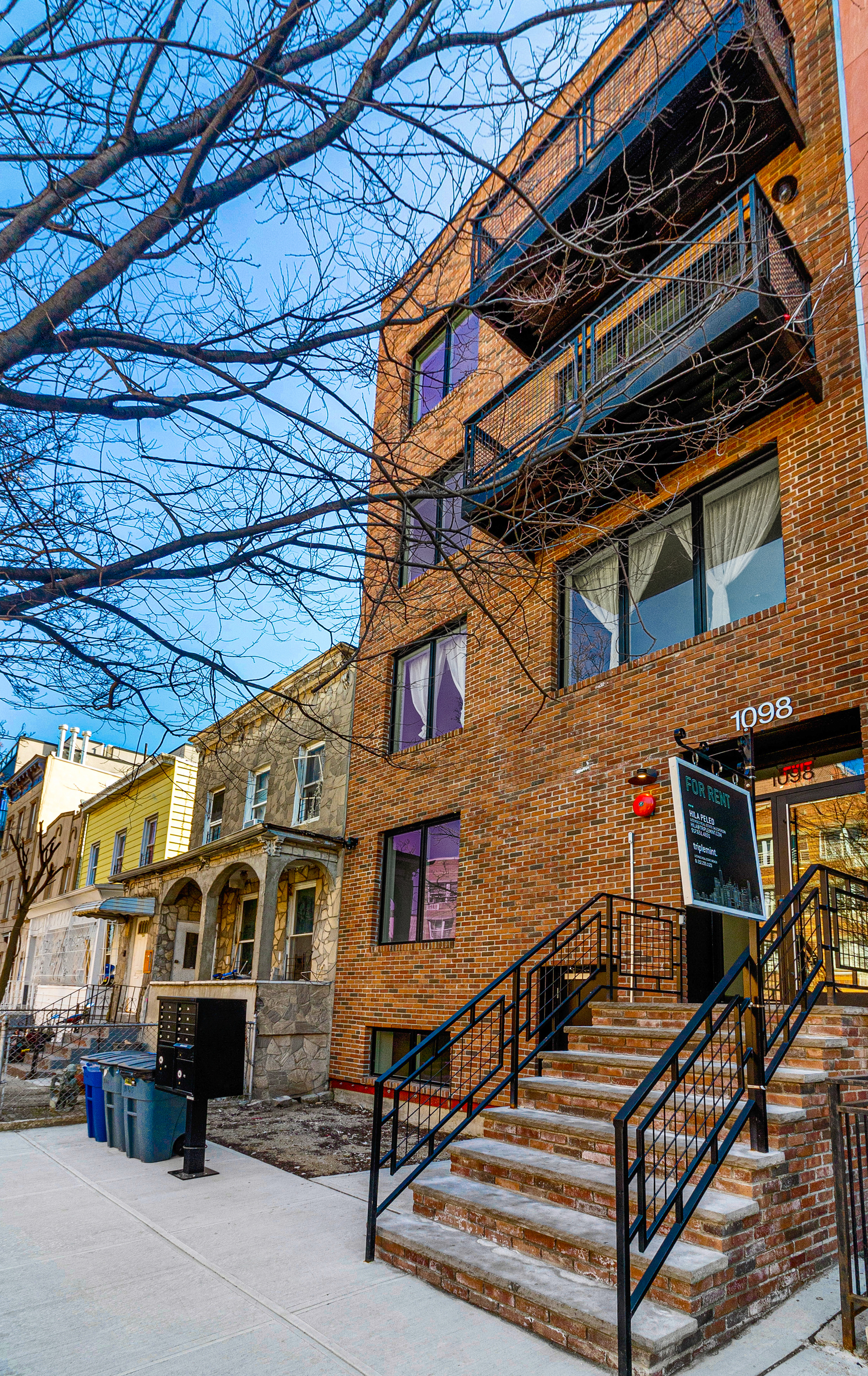 1098 Madison Street, Unit 1A Brooklyn, NY 11221 - Photo 14 of 15 a view of a building with a street