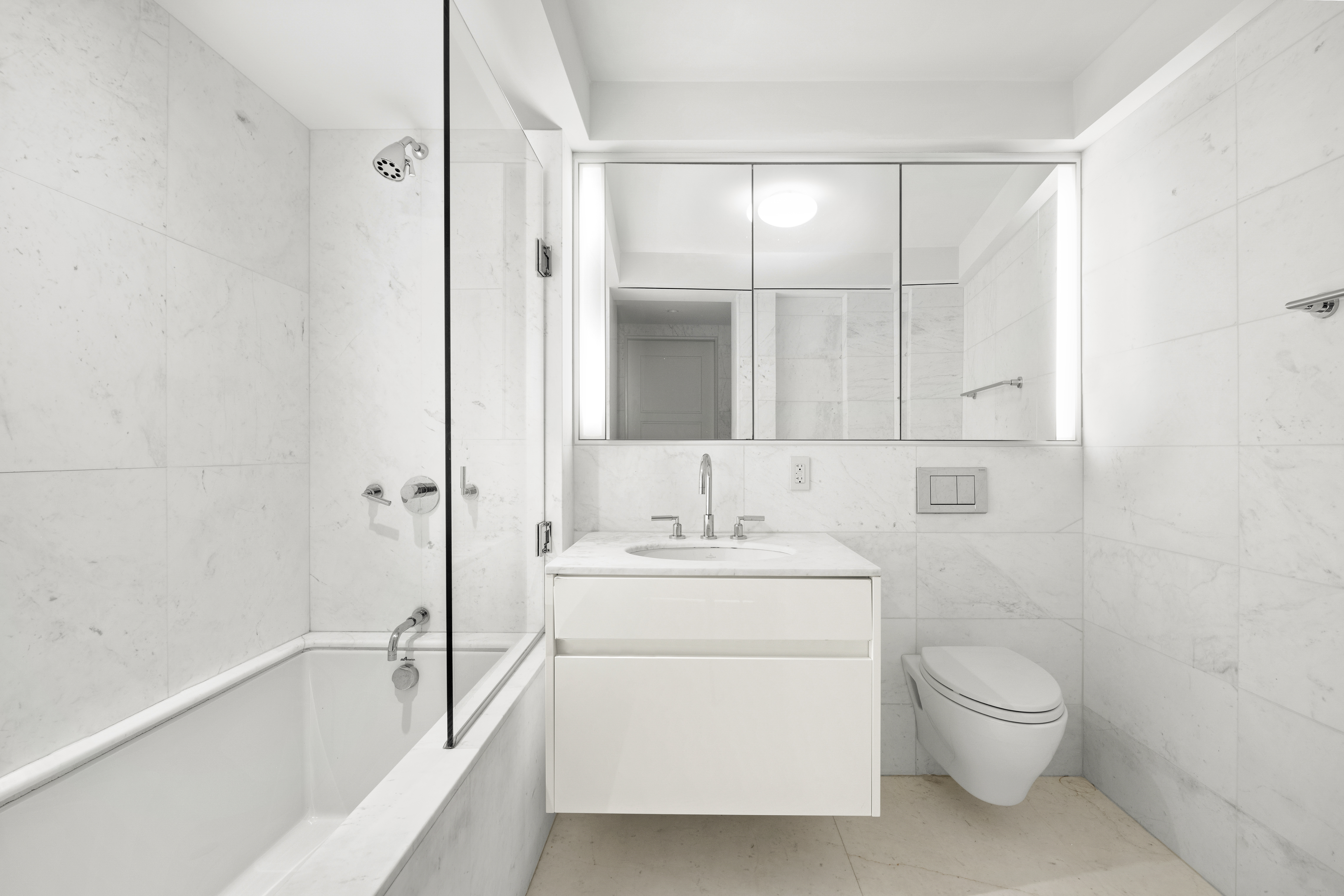 737 Park Avenue, Unit 6A Manhattan, NY 10021 - Photo 9 of 14 a bathroom with a toilet a sink and a bathtub