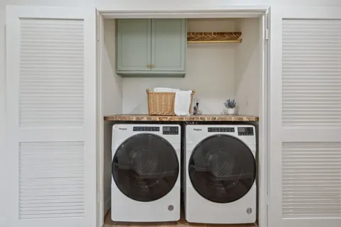 a house with a flower garden in front of it