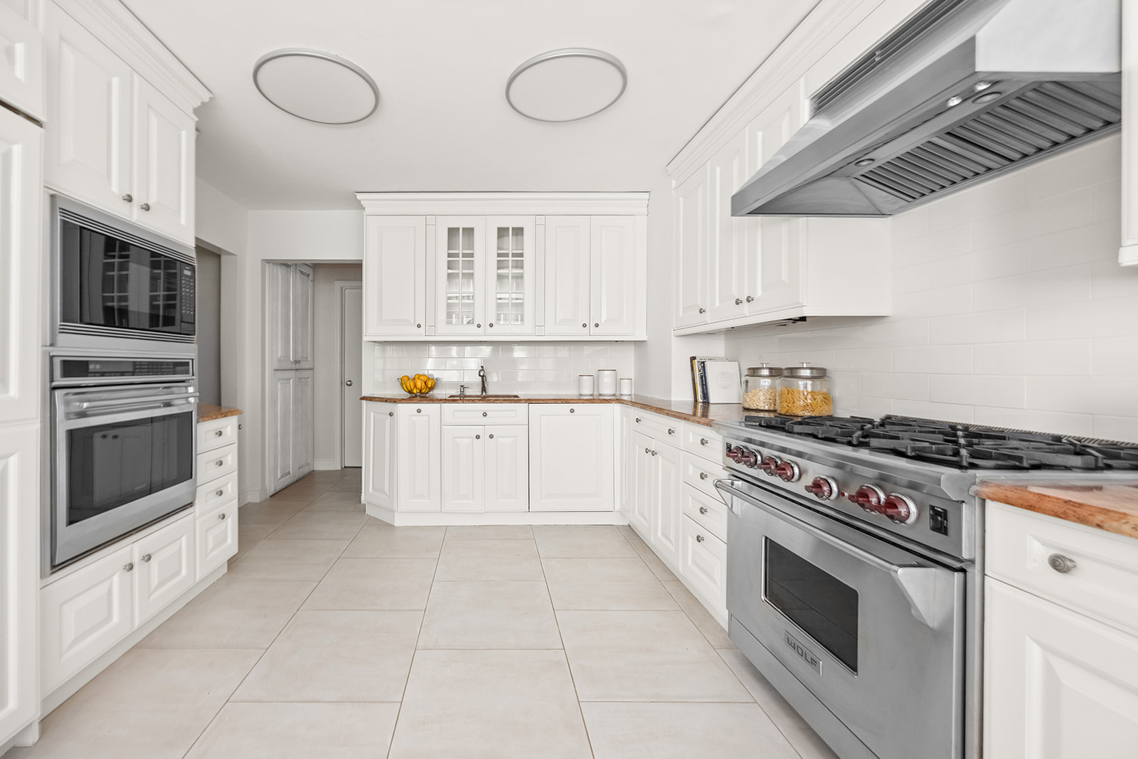 69 West 9th Street, Unit 2B Manhattan, NY 10011 - Photo 7 of 18 a kitchen with stainless steel appliances granite countertop a stove and a microwave