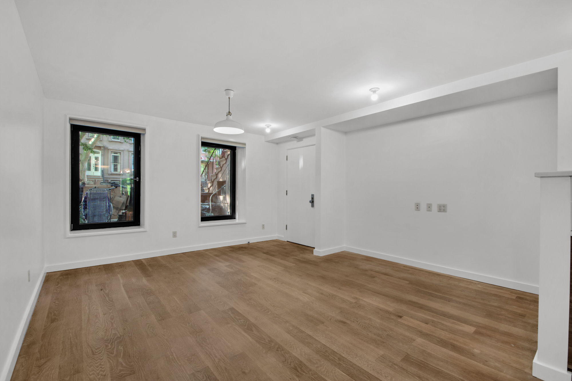 435 Putnam Avenue, Unit GARDEN Brooklyn, NY 11221 - Photo 2 of 11 a view of empty room with wooden floor and fan
