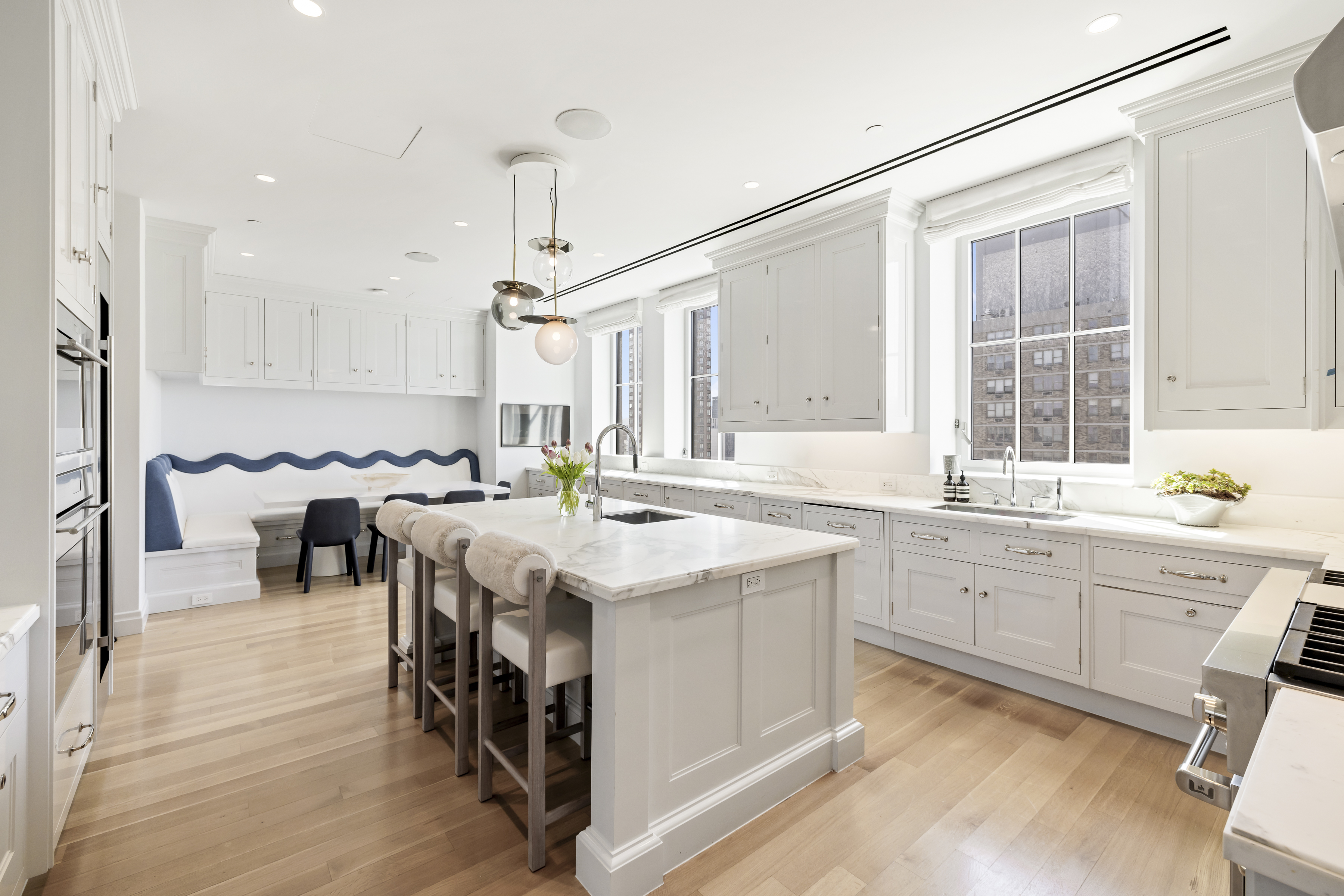 301 East 80th Street, Unit 25B Manhattan, NY 10075 - Photo 8 of 38 a kitchen with sink stove and cabinets