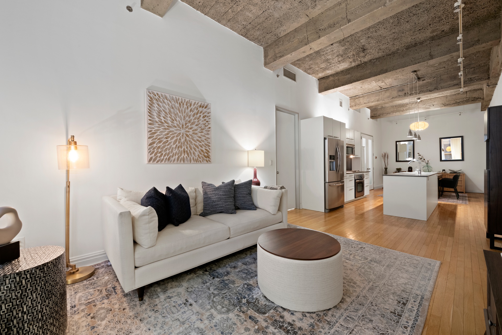 419 West 55th Street, Unit 2D Manhattan, NY 10019 - Photo 2 of 10 a living room with furniture and a wooden floor