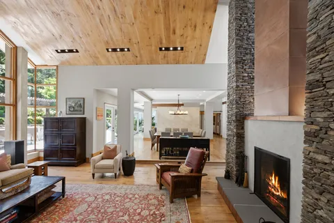 a kitchen with stainless steel appliances granite countertop a sink and dishwasher a refrigerator with wooden floor