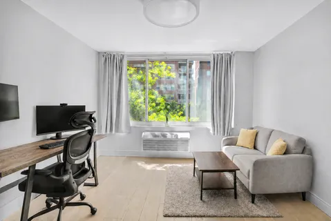 a workspace with furniture and a window