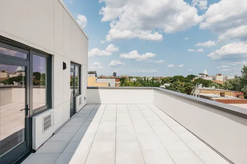 a view of balcony with yard