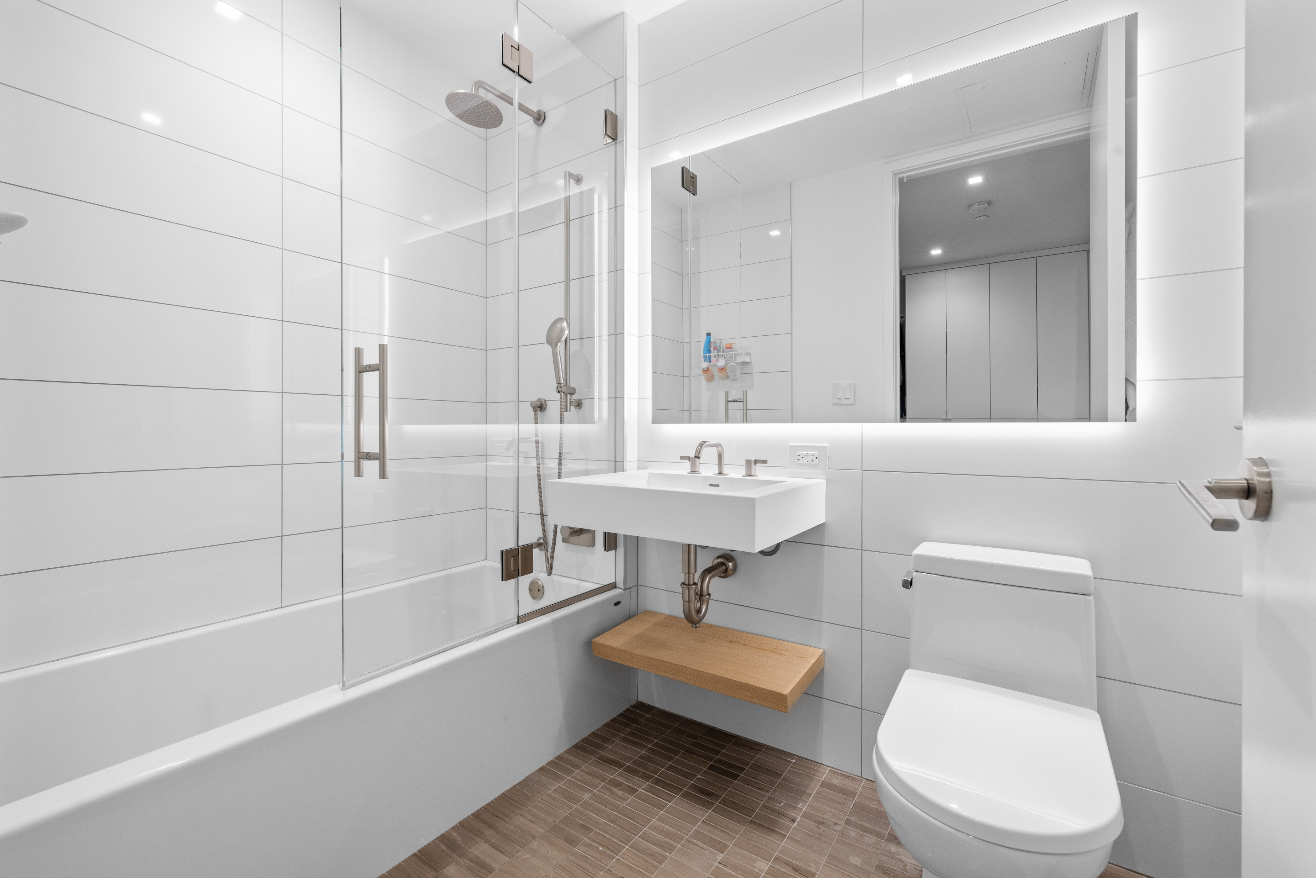 98 Front Street, Unit PH Brooklyn, NY 11201 - Photo 13 of 26 a bathroom with a sink a toilet and a bathtub