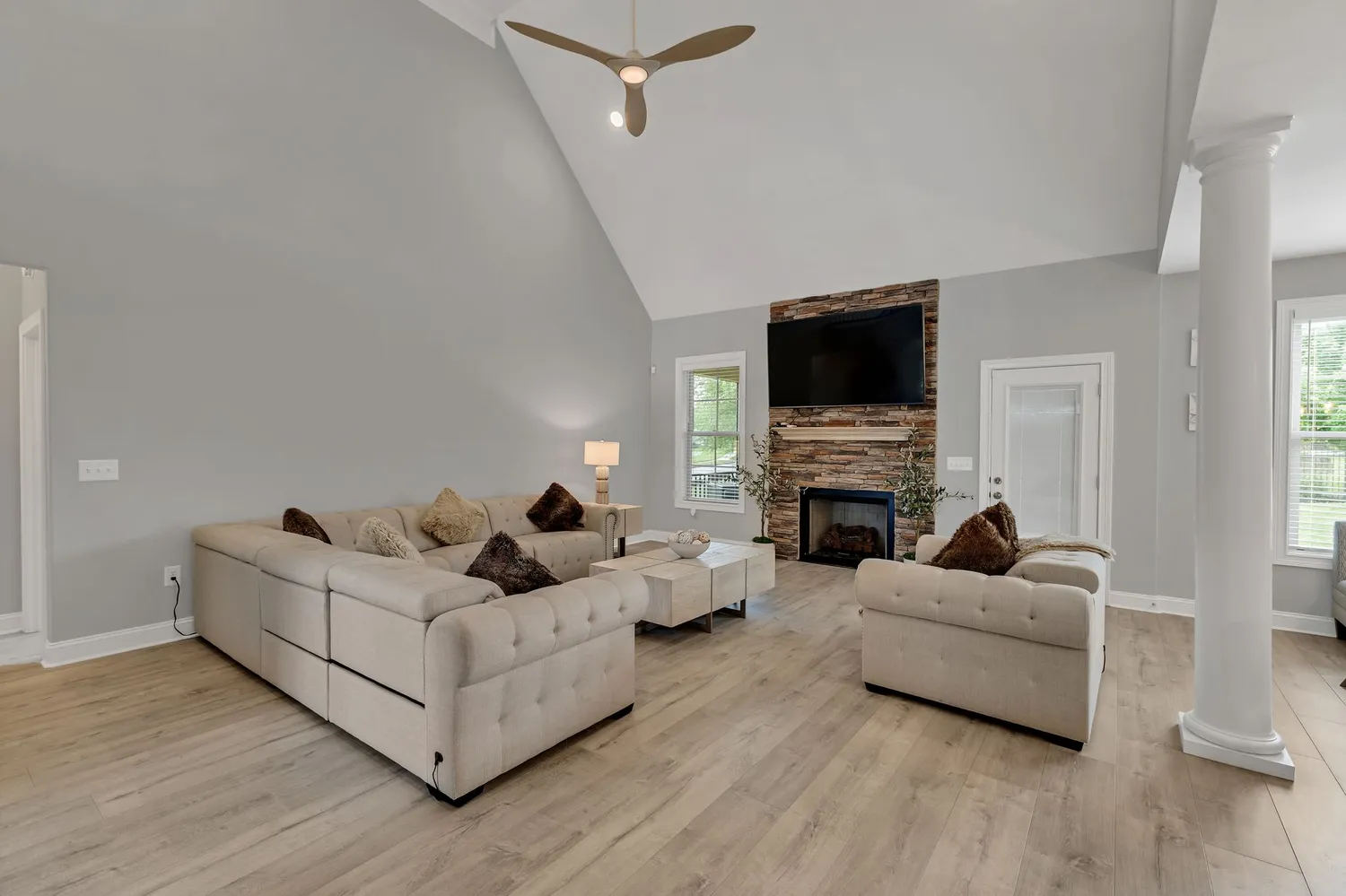 a living room with furniture and a flat screen tv