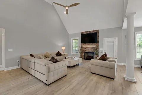 a living room with furniture and a flat screen tv
