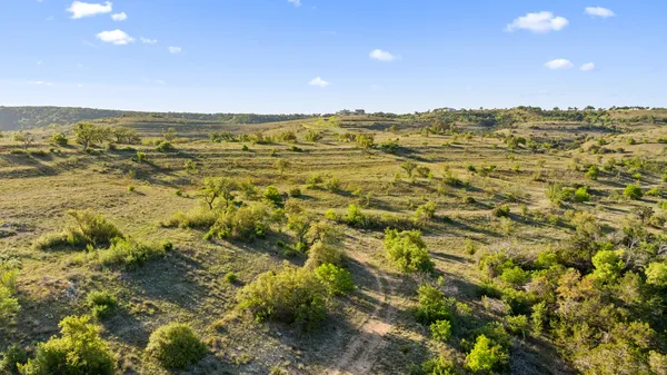 a view of a city with mountains in the background