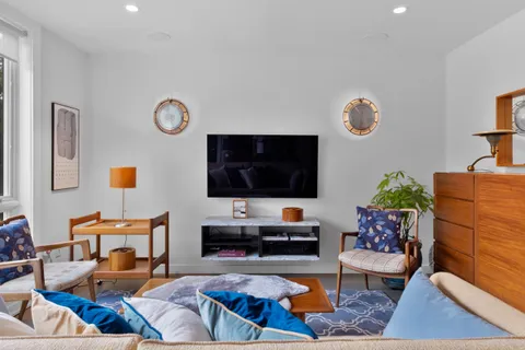 a view of balcony with furniture and wooden deck