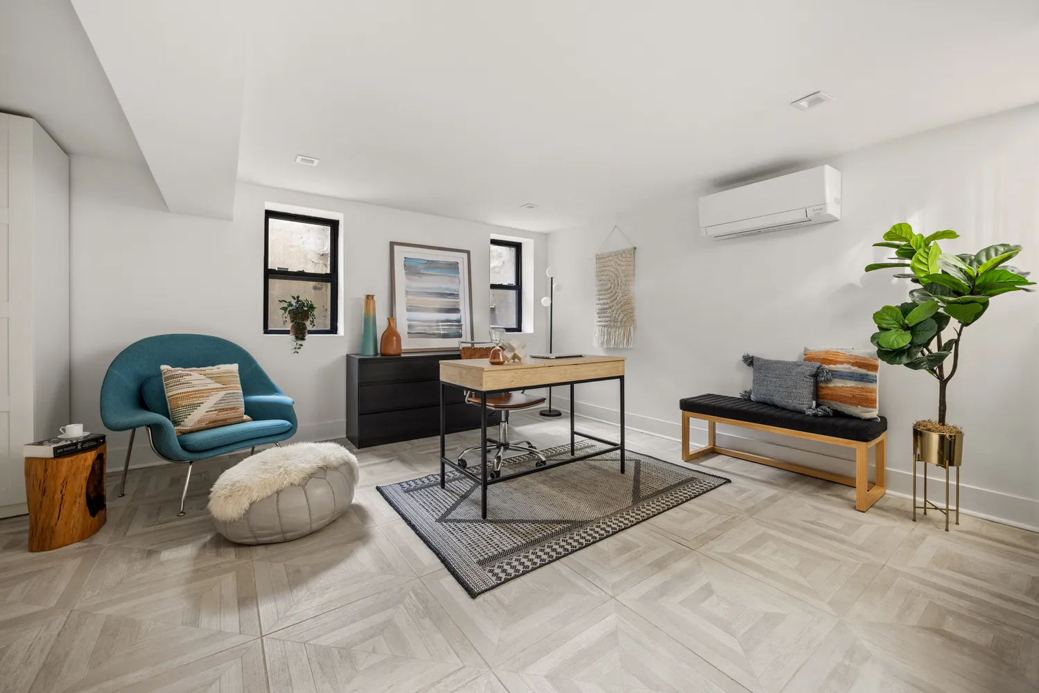 a living room with furniture and a potted plant