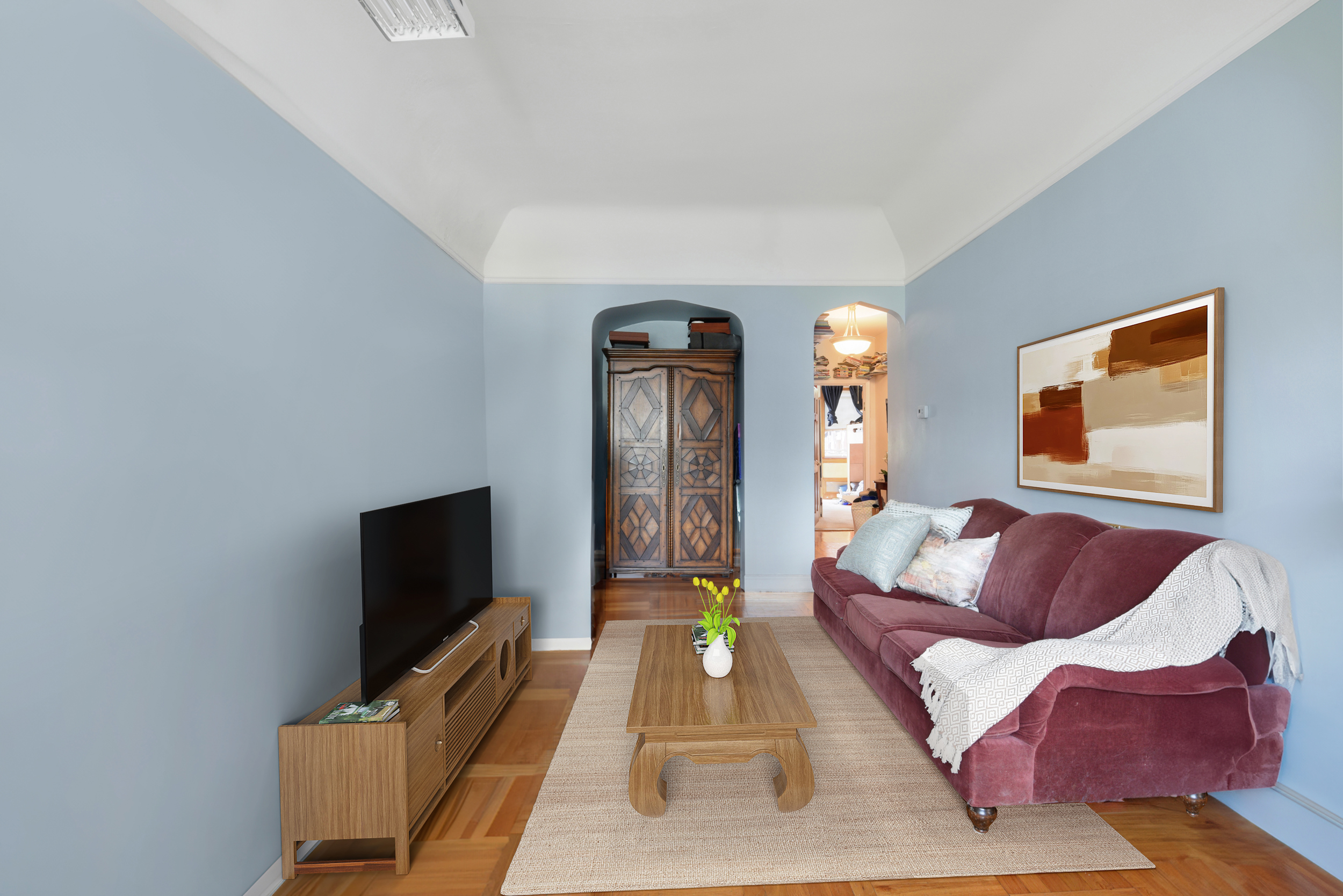 233 Battery Avenue Brooklyn, NY 11209 - Photo 2 of 17 a living room with furniture and a flat screen tv