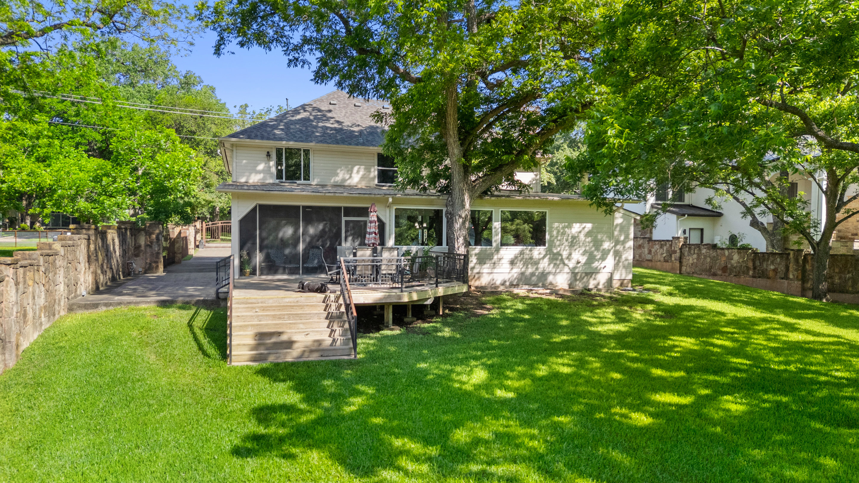 2603 Pearce Road Austin, TX 78730 - Photo 19 of 41 a view of house with a garden and patio