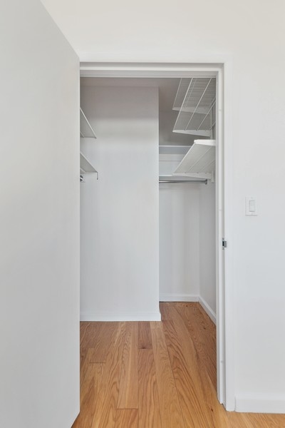 50 Oceana Drive West, Unit 5G Brooklyn, NY 11235 - Photo 9 of 12 a view of walk in closet with wooden floor