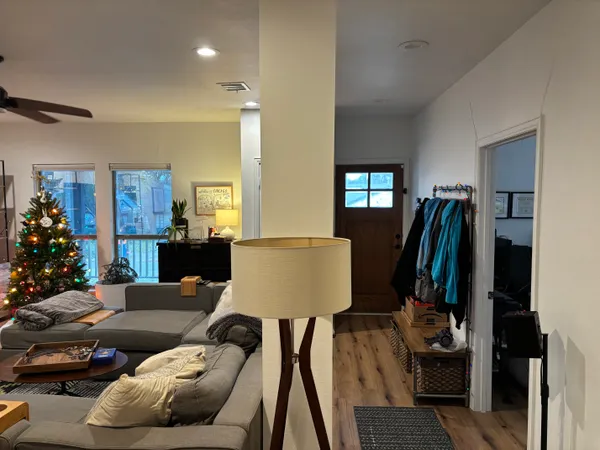 a living room with furniture and a lamp