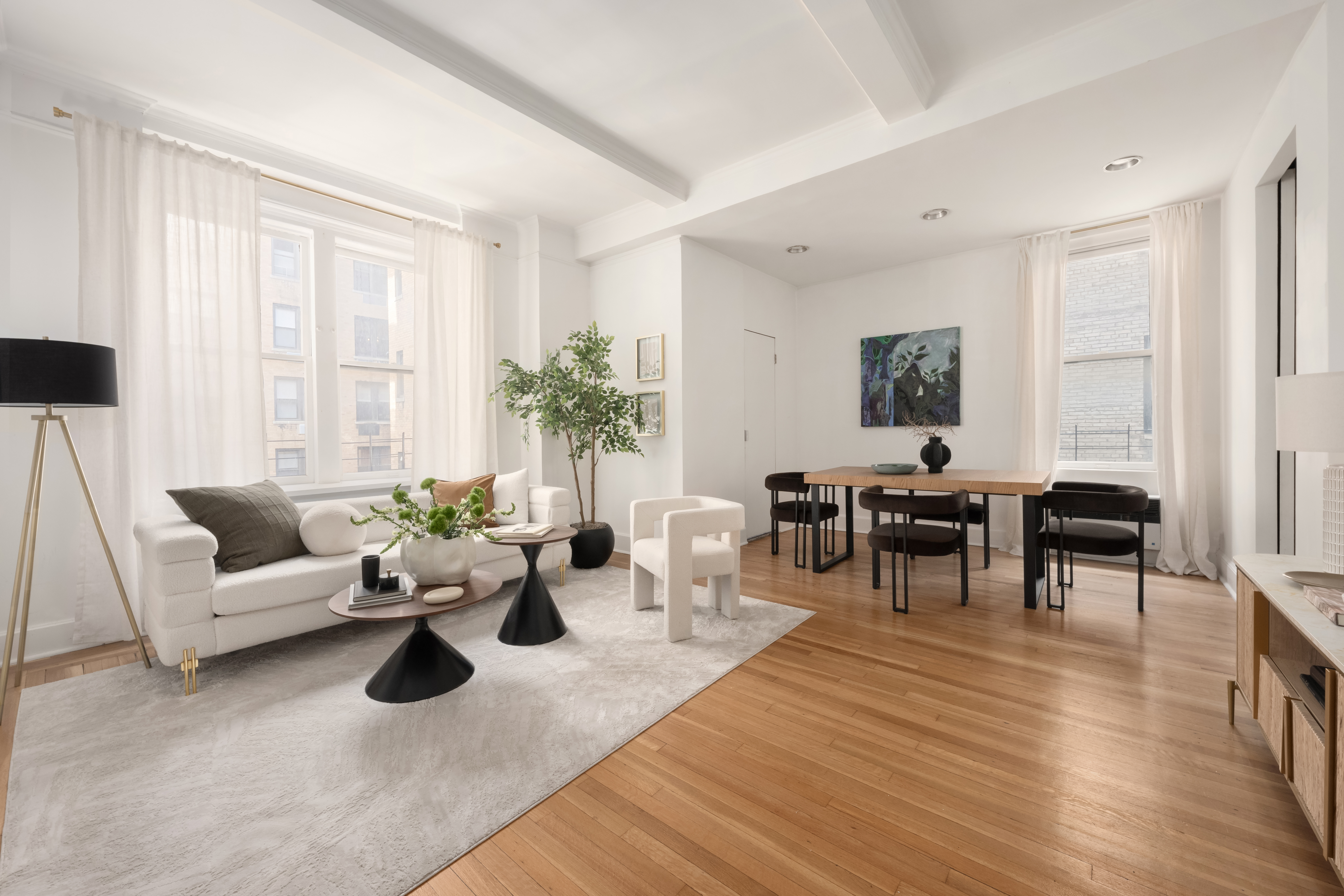1060 Park Avenue, Unit 11A Manhattan, NY 10128 - Photo 4 of 12 a living room with furniture and wooden floor