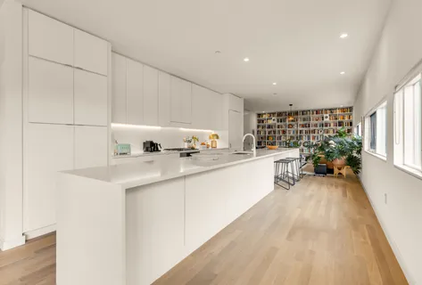 a kitchen with sink and cabinets