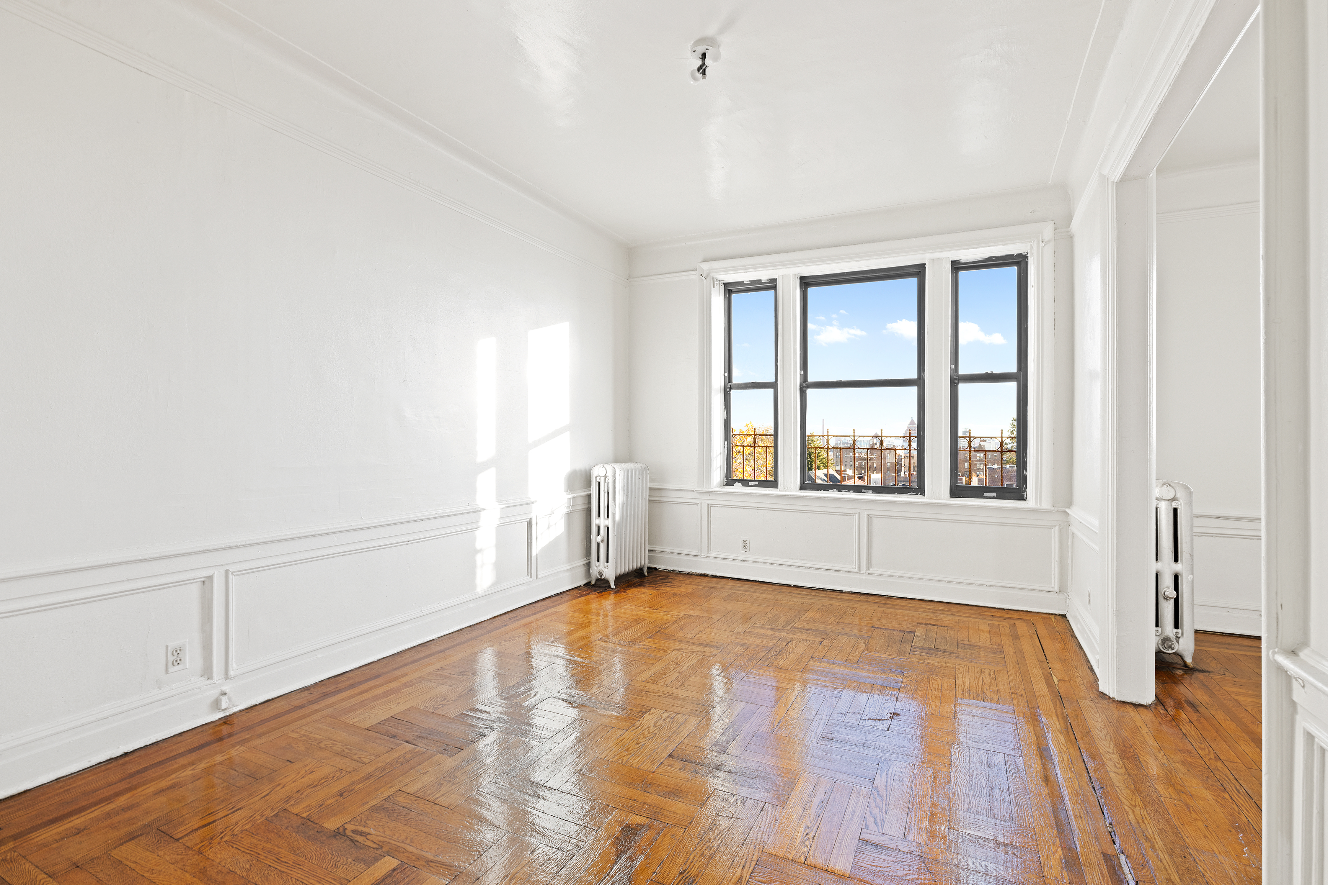 421 Crown Street, Unit 18R Brooklyn, NY 11225 - Photo 3 of 8 a view of an empty room with a window