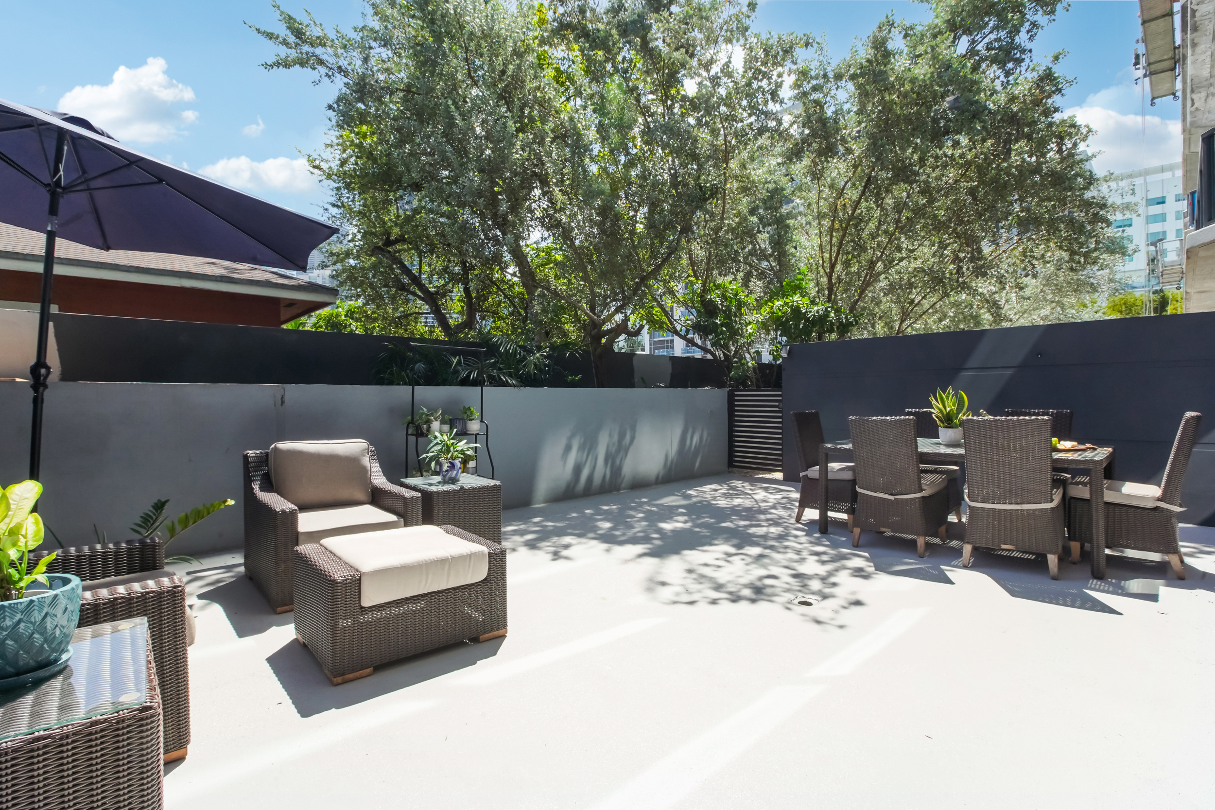 201 Southwest 17th Road, Unit 311 Miami, FL 33129 - Photo 3 of 21 a view of backyard with seating space and trees