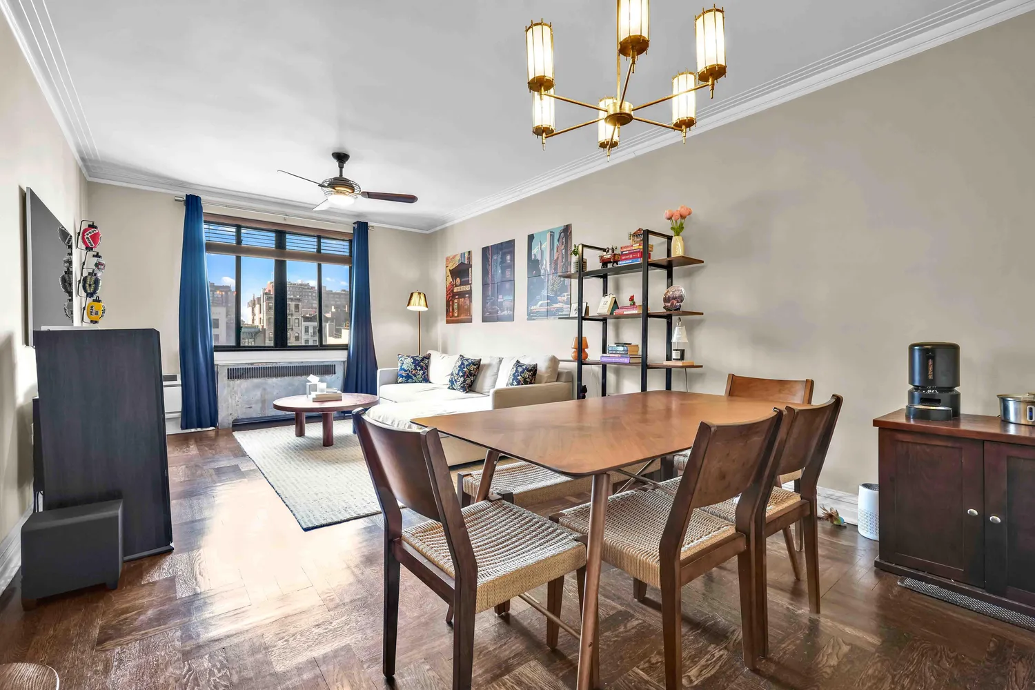 a view of a dining room with furniture and a chandelier