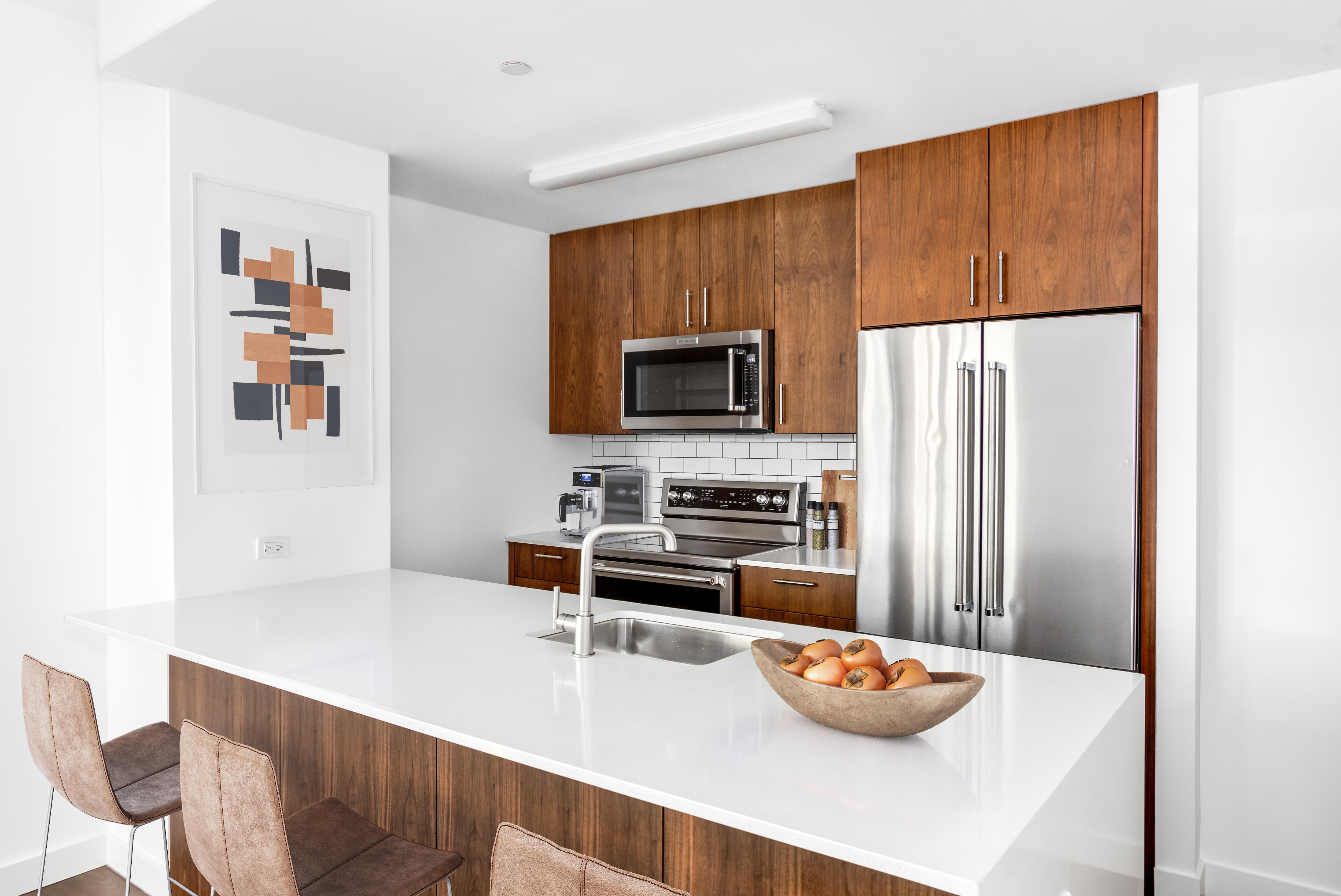 120 Nassau Street, Unit 27G Brooklyn, NY 11201 - Photo 2 of 13 a kitchen with stainless steel appliances a dining table and chairs