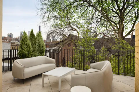 a front view of a brick building with many windows
