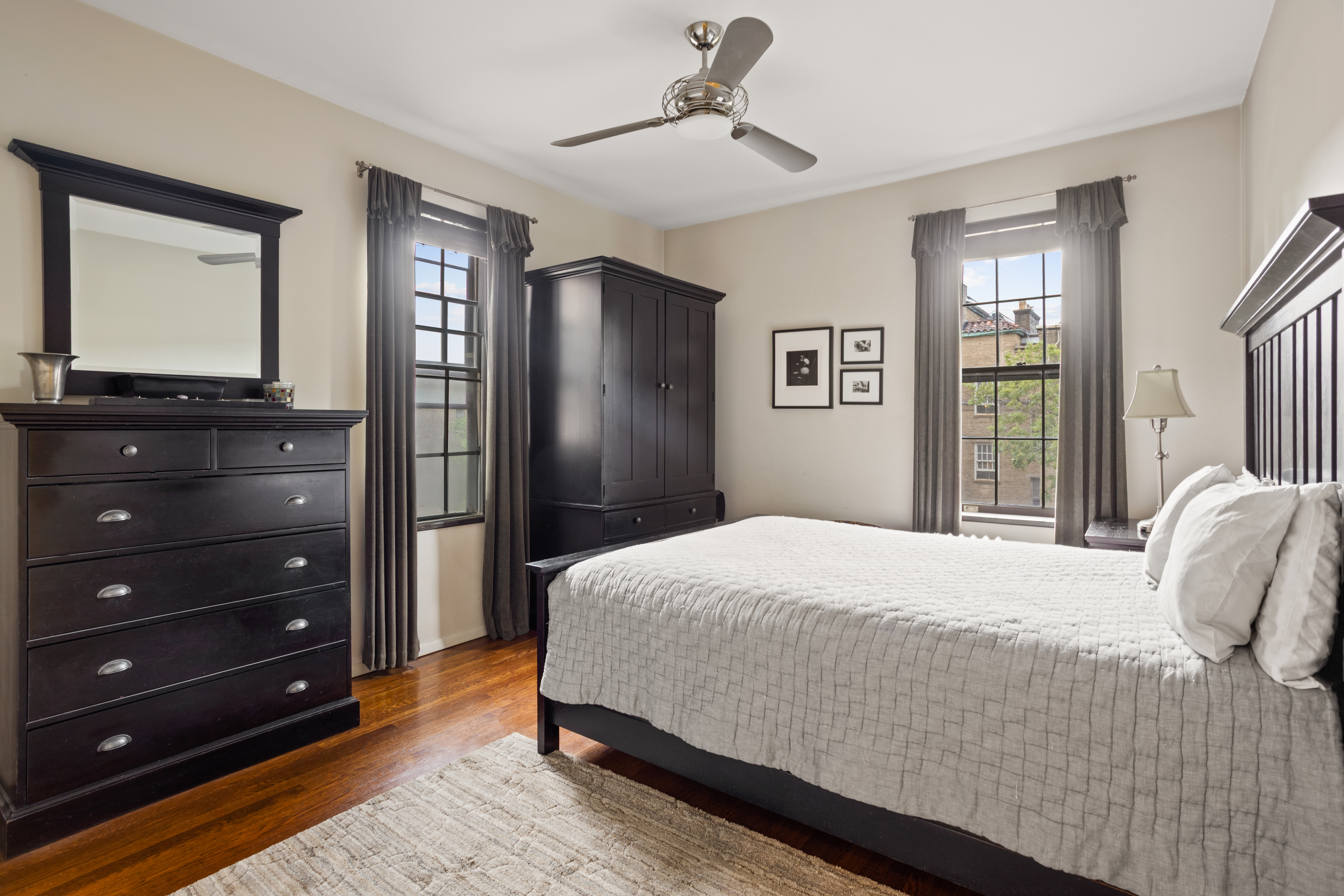 33-28 81st Street, Unit 61B Queens, NY 11372 - Photo 6 of 11 a bedroom with a bed and a window