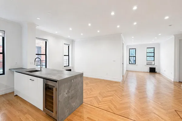 a kitchen with stainless steel appliances granite countertop a sink and a stove
