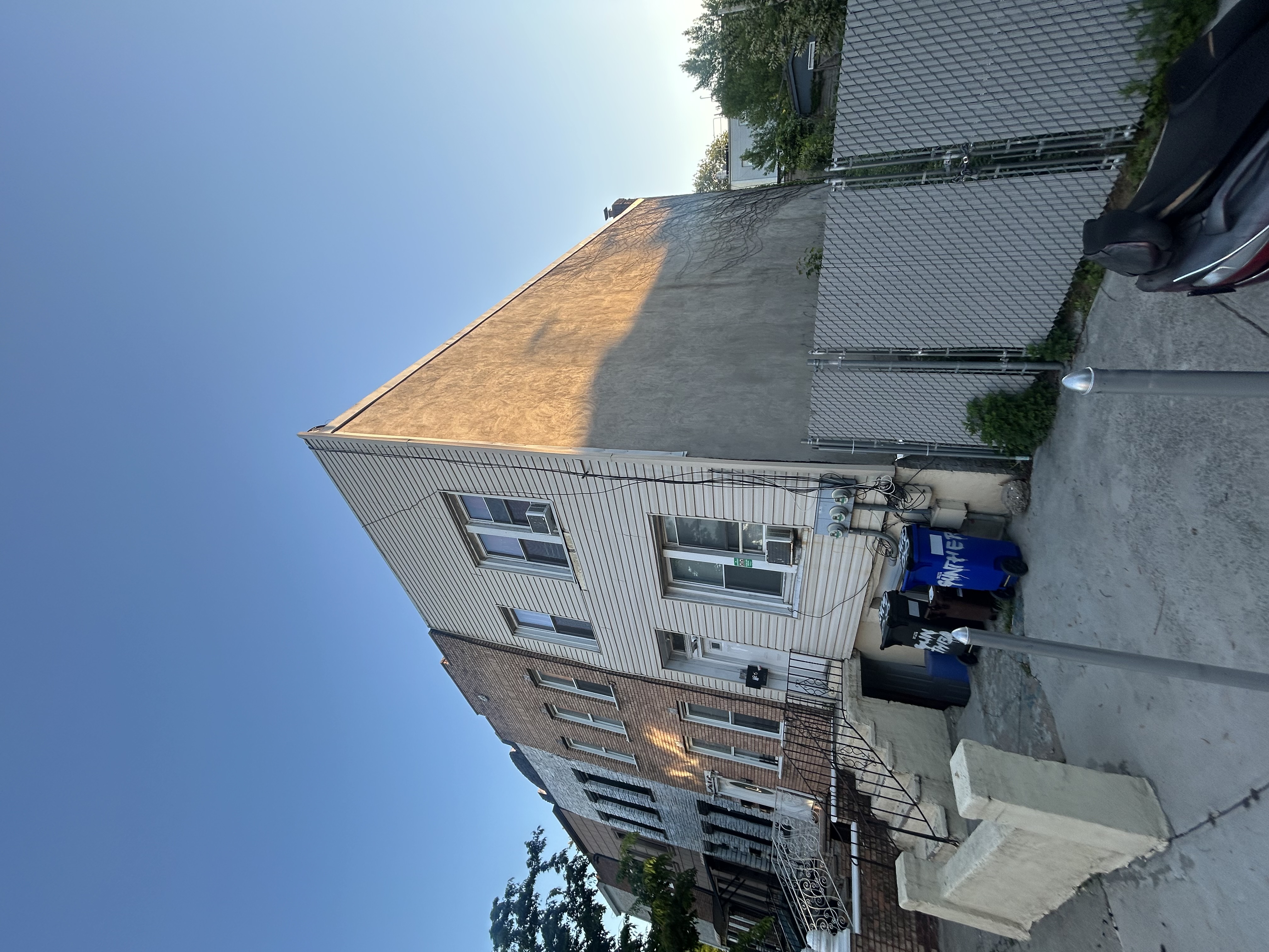 26 Gunther Place Brooklyn, NY 11233 - Photo 2 of 3 a view of a house with a backyard
