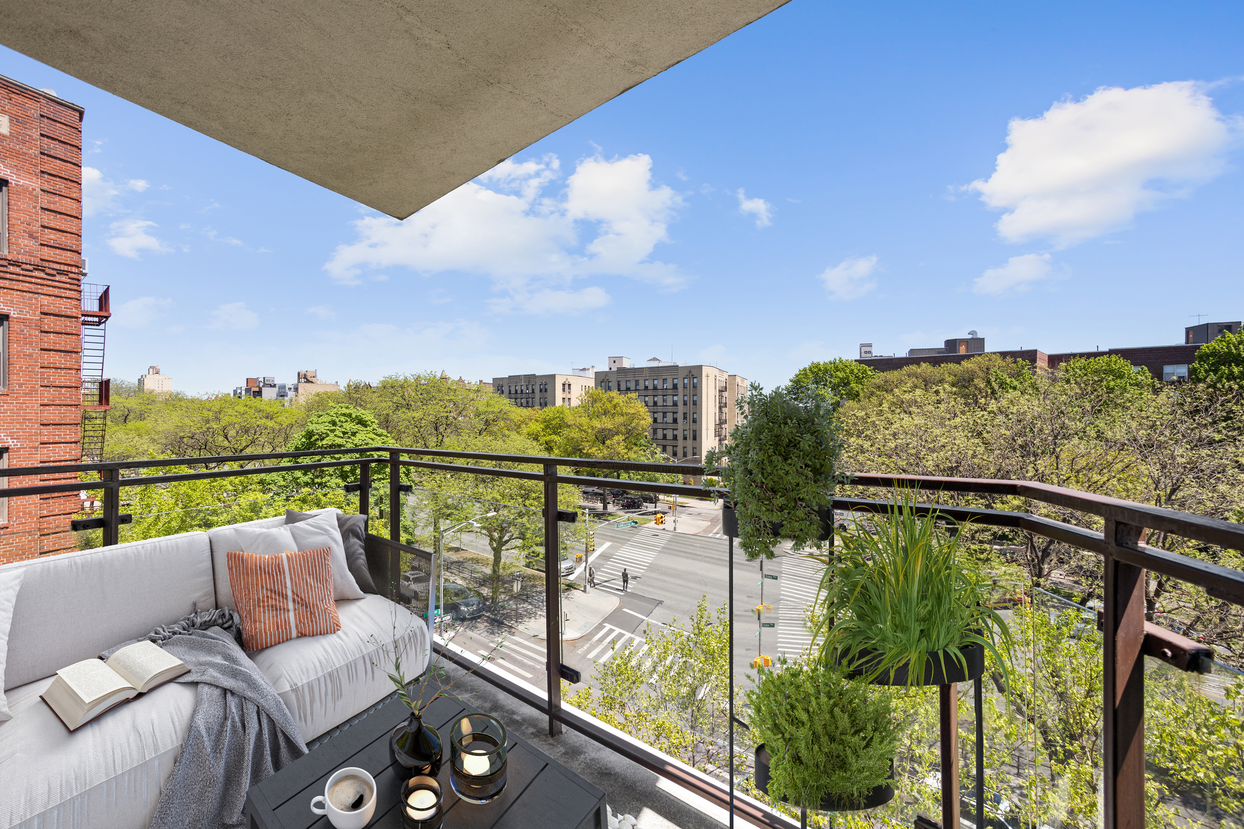 702 Ocean Parkway, Unit 5R Brooklyn, NY 11230 - Photo 4 of 13 a view of a balcony with couches and wooden floor