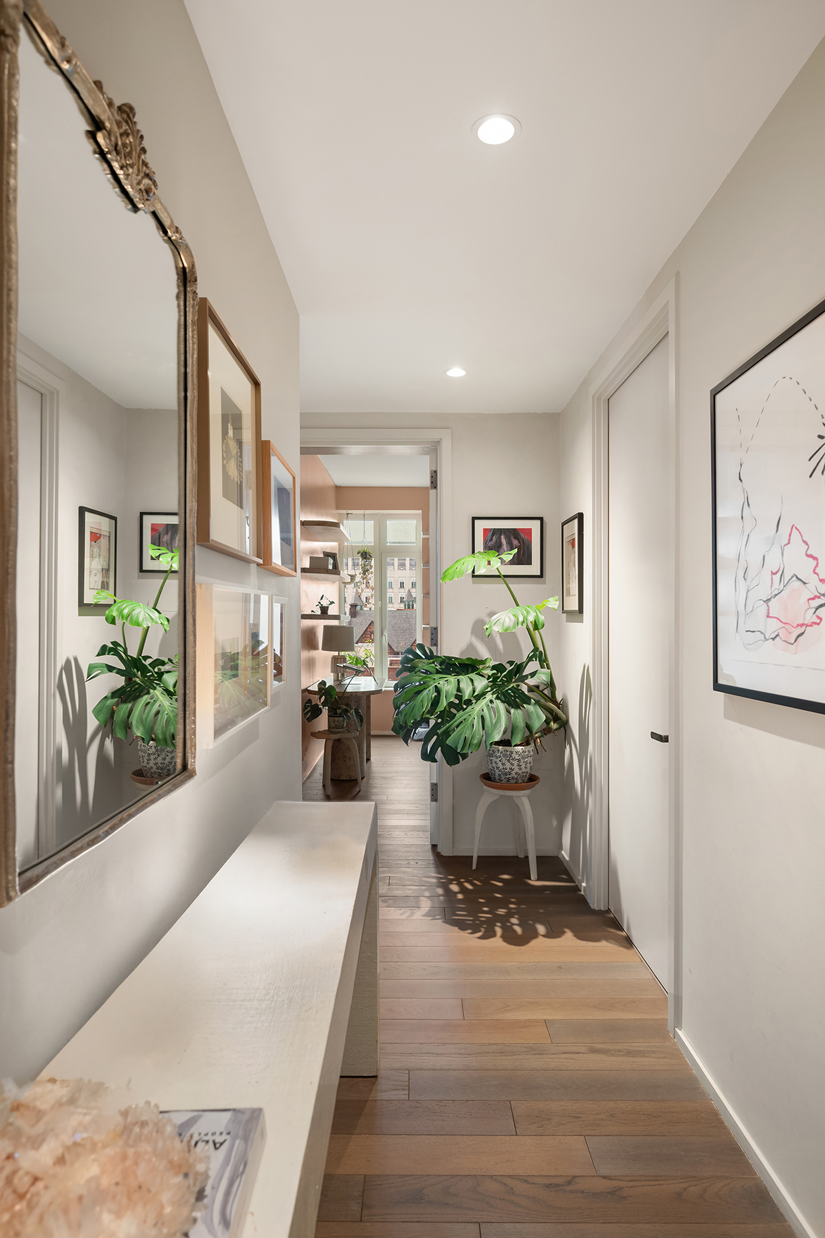 543 West 122nd Street, Unit 10E Manhattan, NY 10027 - Photo 2 of 12 a living room with furniture and potted plant