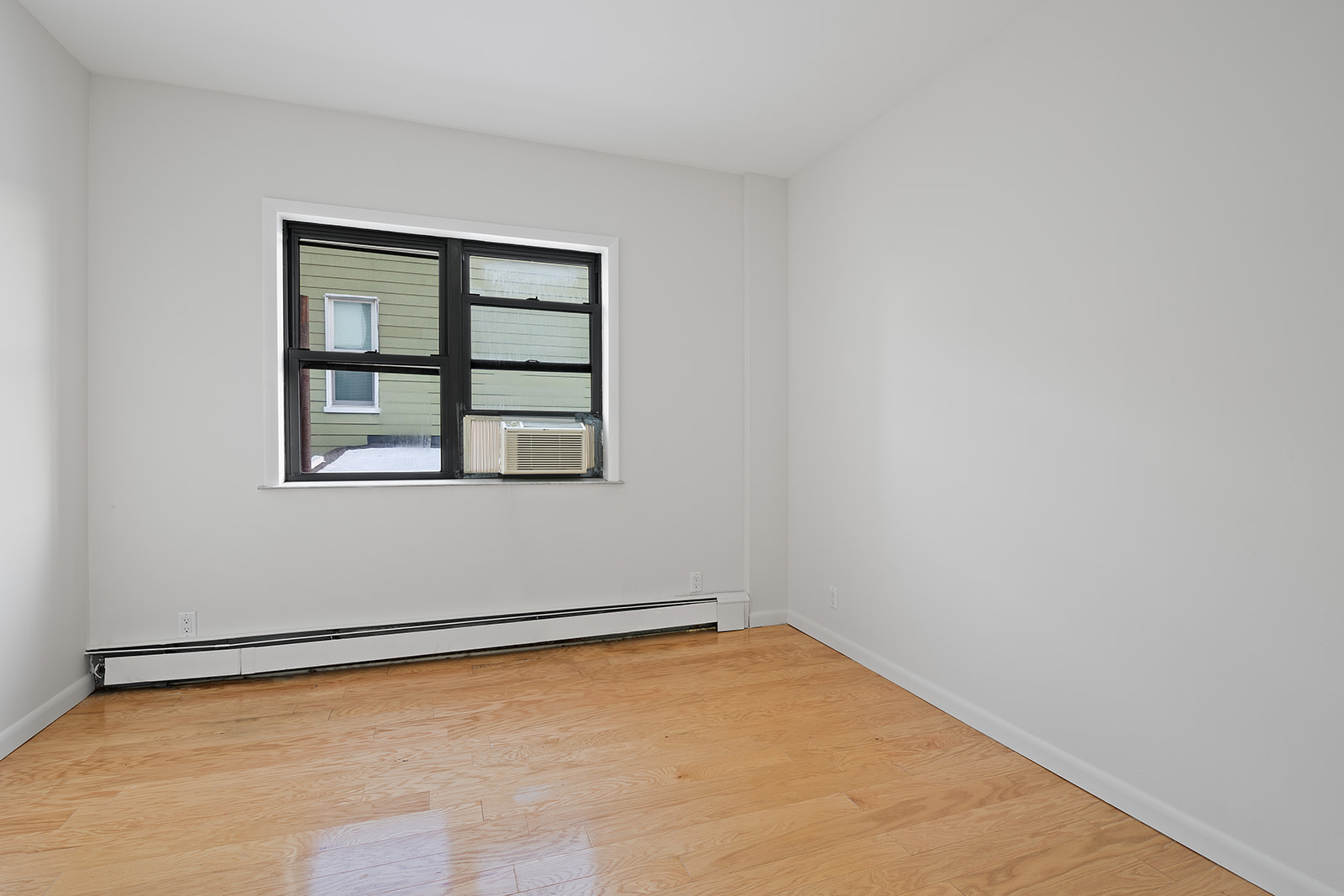 188 Eckford Street, Unit 4 Brooklyn, NY 11222 - Photo 3 of 5 a view of a big room with wooden floor and windows