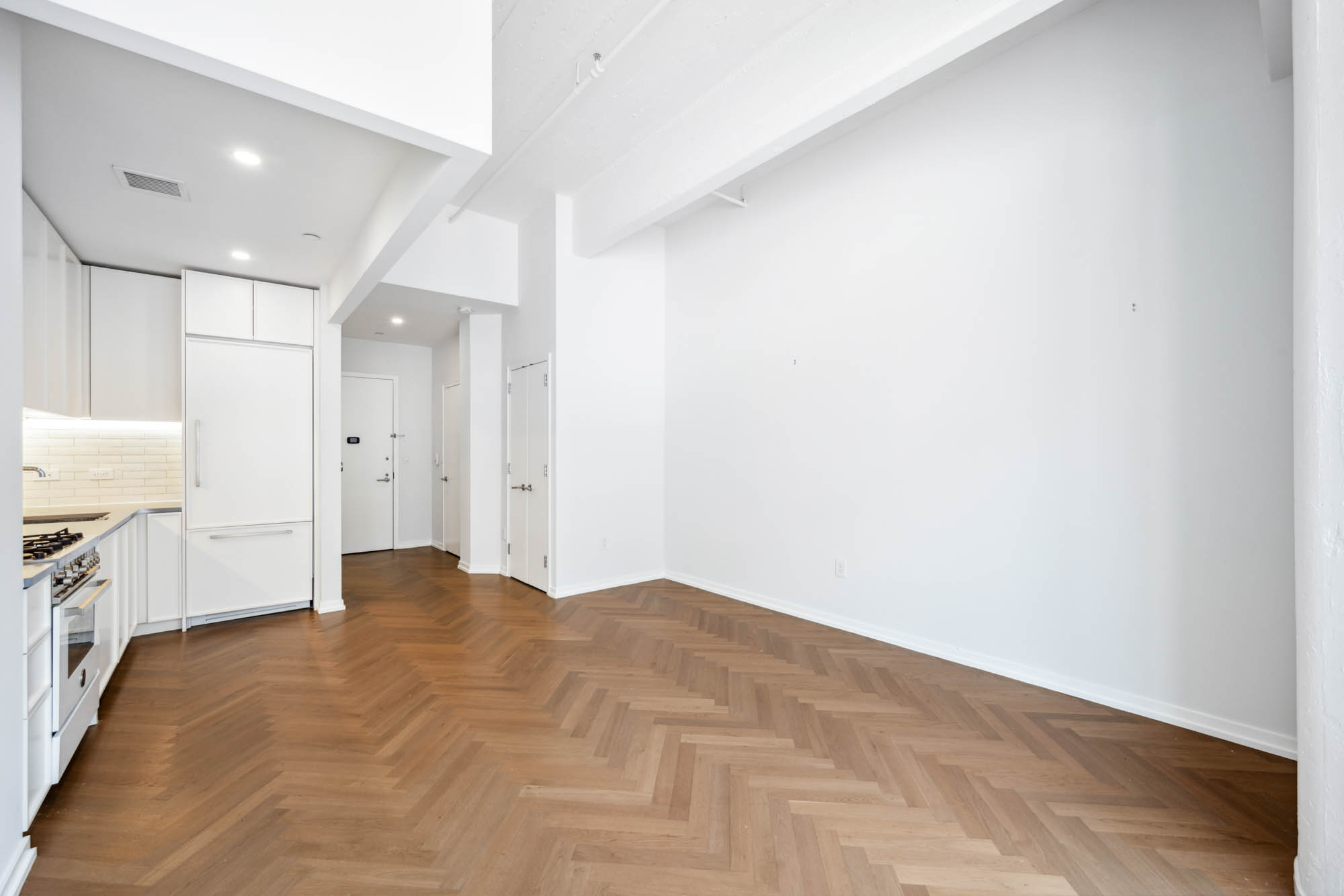 184 Kent Avenue, Unit D512 Brooklyn, NY 11249 - Photo 4 of 11 a view of a kitchen with a sink