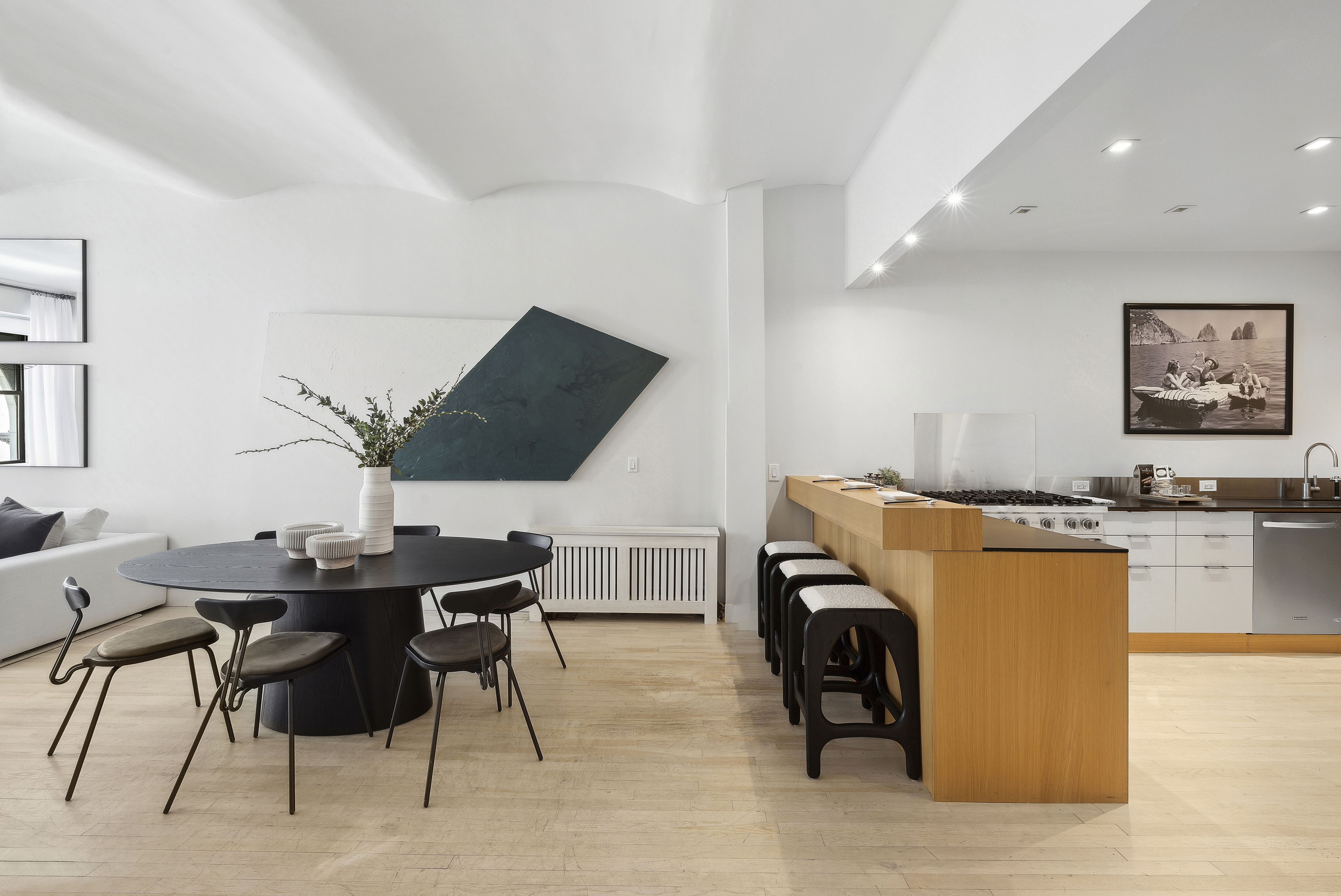 4 West 16th Street, Unit 4A Manhattan, NY 10011 - Photo 5 of 11 a view of a dining room with furniture and a chandelier