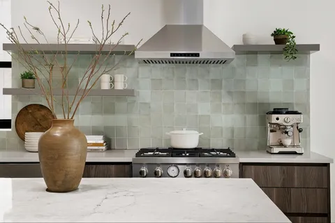 a kitchen with a stove and cabinets