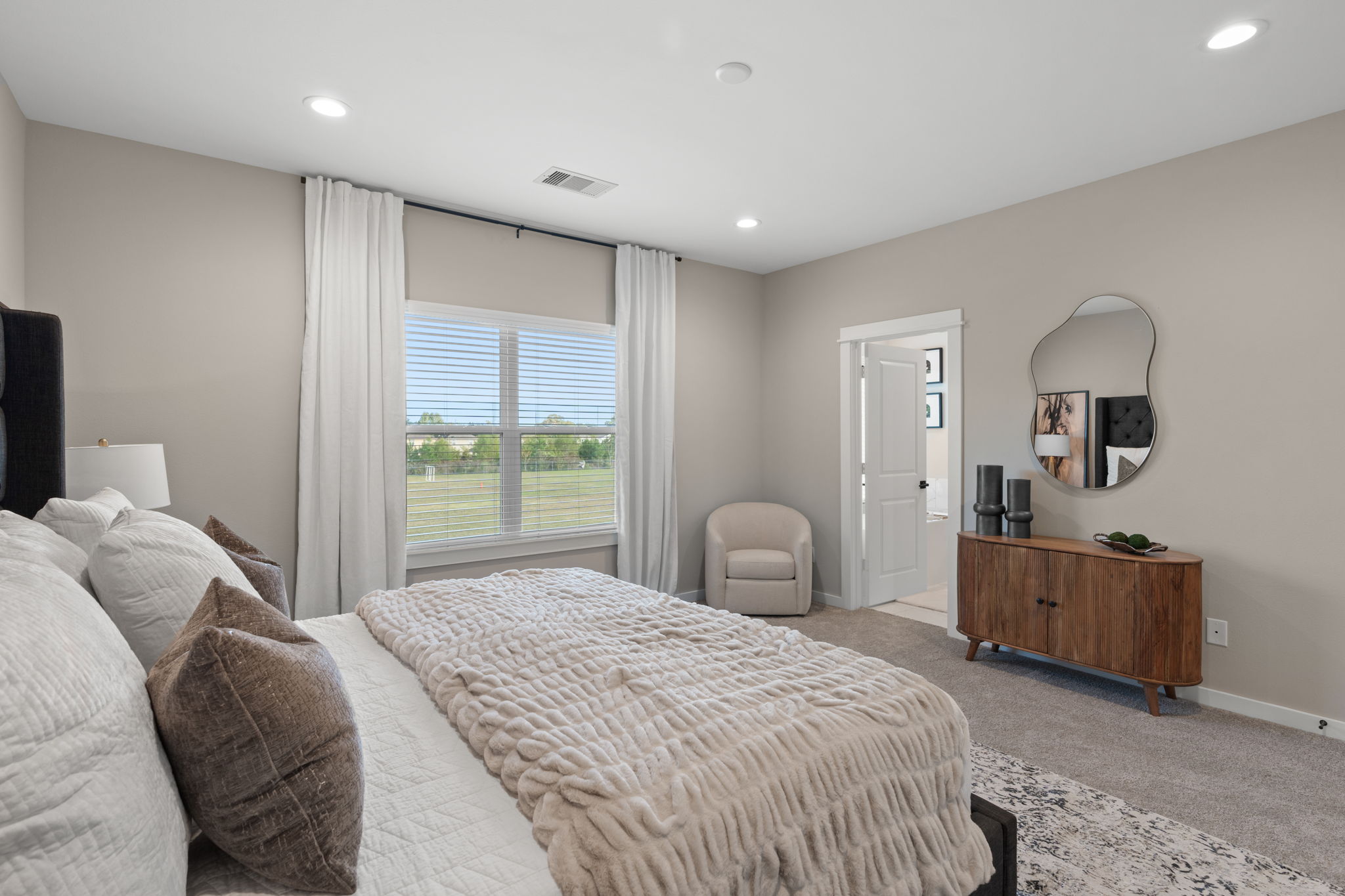 11303 Stonework Grv Lane Houston, TX 77076 - Photo 22 of 39 a bedroom with a bed and a dresser
