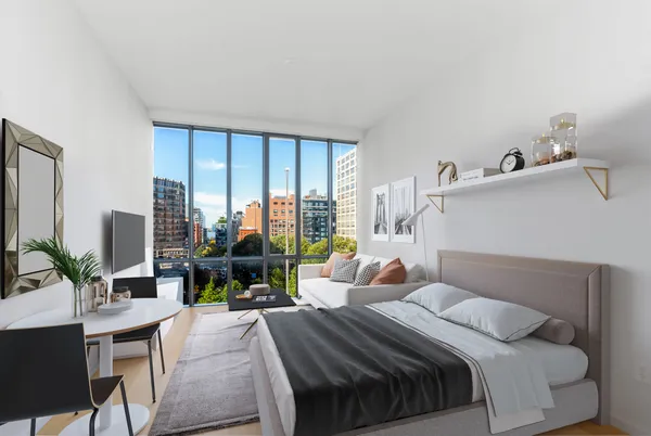 a bedroom with a large bed and a large window