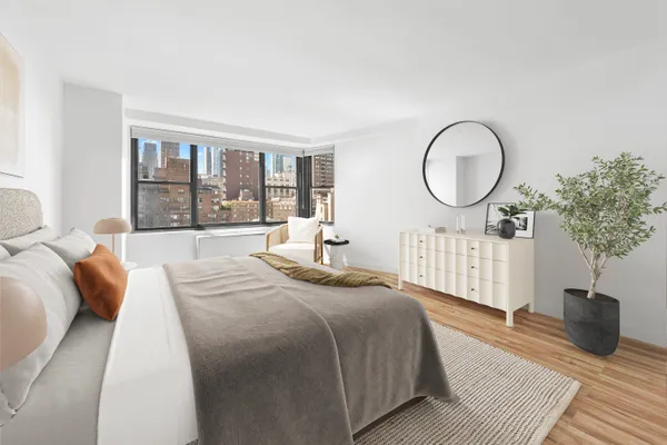 a bed room with a bed and a window
