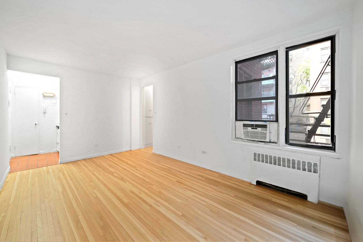 a view of an empty room with a window