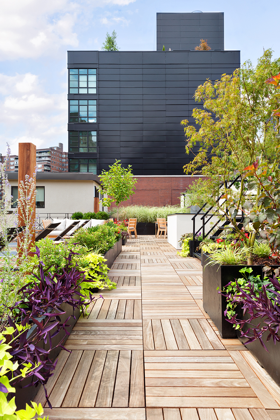 245 West 25th Street, Unit PHD Manhattan, NY 10001 - Photo 10 of 16 a view of a garden with flowers and flowers