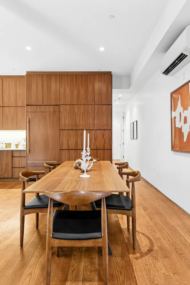 a view of a dining table and chairs in a room