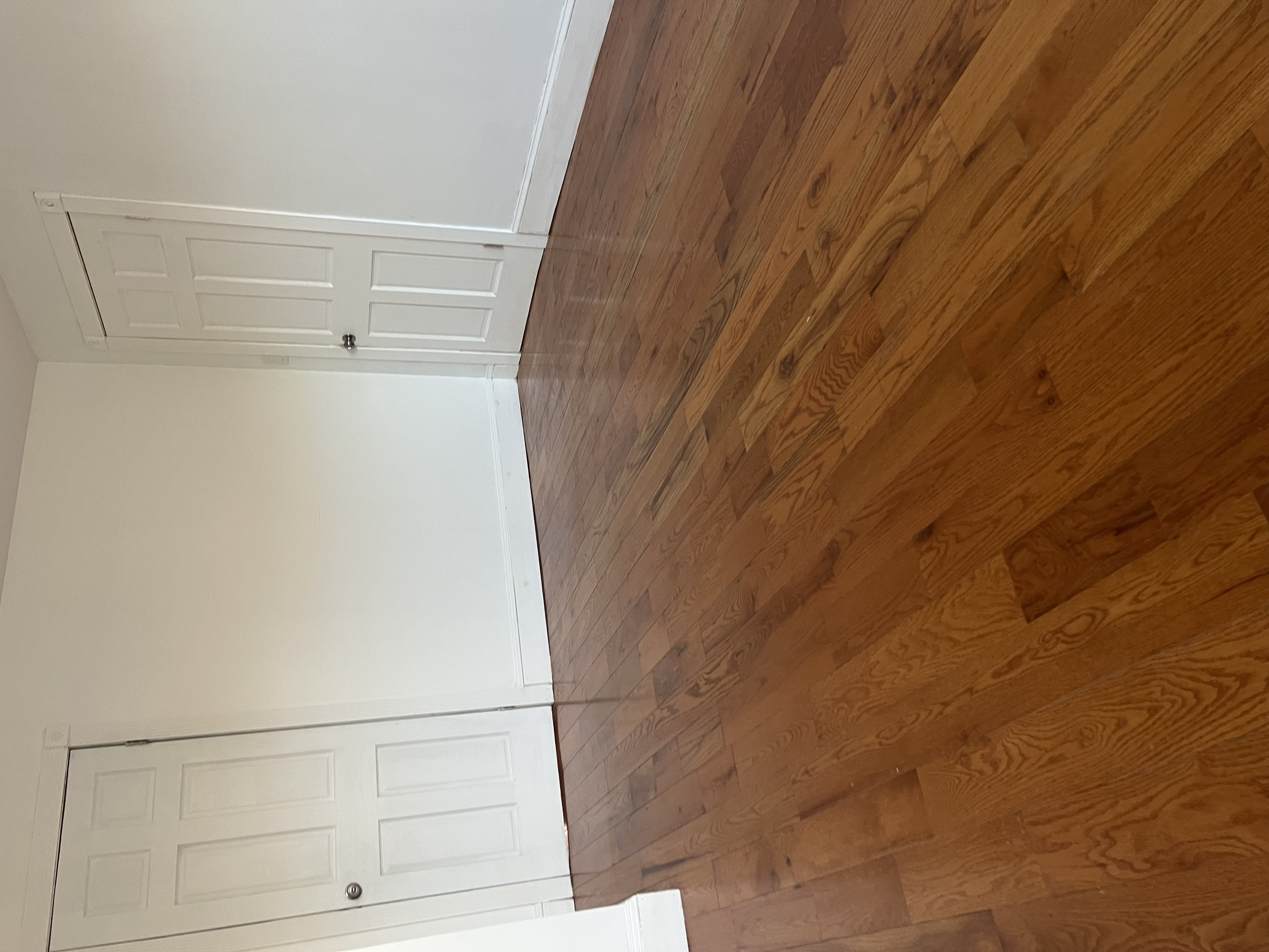 160 Macon Street, Unit 3 Brooklyn, NY 11216 - Photo 5 of 7 an empty room with wooden floor