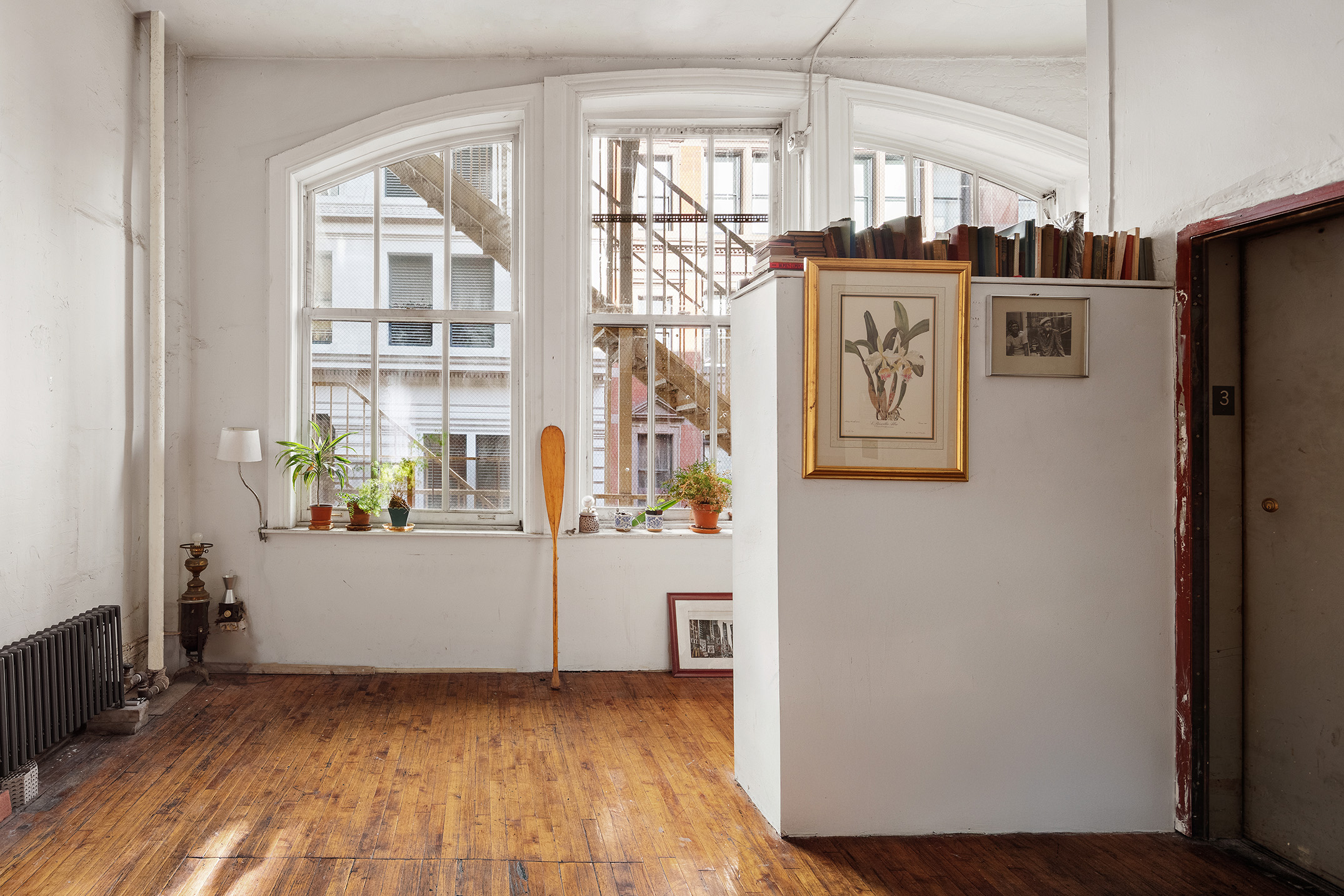 7 East 17th Street, Unit 3N Manhattan, NY 10003 - Photo 3 of 10 a view of a refrigerator in kitchen and wooden floor